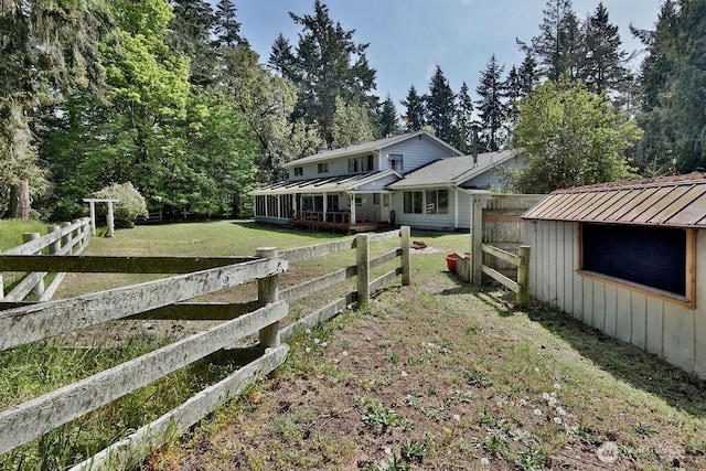 70 Shadow Trl, Sequim, WA 98382 - view of front of house featuring metal roof, fence, a front lawn, and a standing seam roof