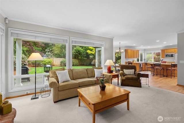 living room featuring crown molding, light carpet, baseboards, recessed lighting, and light wood-style flooring