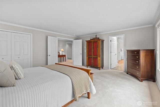 bedroom with a closet, ornamental molding, baseboards, and light colored carpet