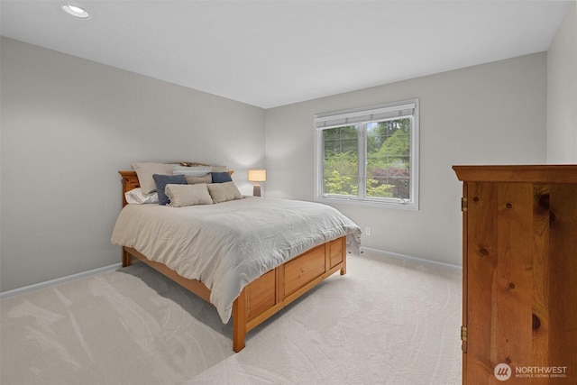 bedroom featuring baseboards, light carpet, and recessed lighting