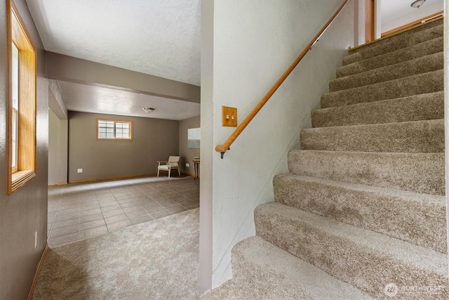 1302 Spruce St, Longview, WA 98632 - stairs featuring tile patterned flooring and baseboards
