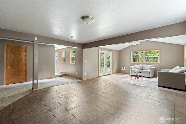 1302 Spruce St, Longview, WA 98632 - carpeted living area with vaulted ceiling, tile patterned floors, baseboards, a textured ceiling, and ceiling fan