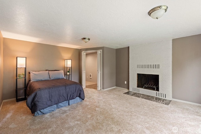 1302 Spruce St, Longview, WA 98632 - bedroom featuring carpet, a brick fireplace, a textured ceiling, and baseboards