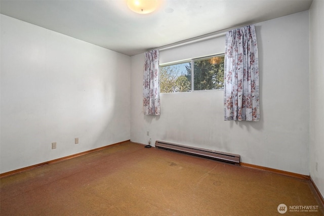 carpeted empty room with baseboards and a baseboard radiator
