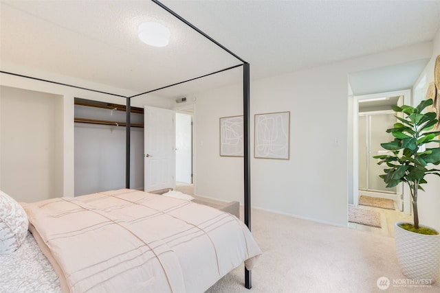 bedroom with baseboards and carpet