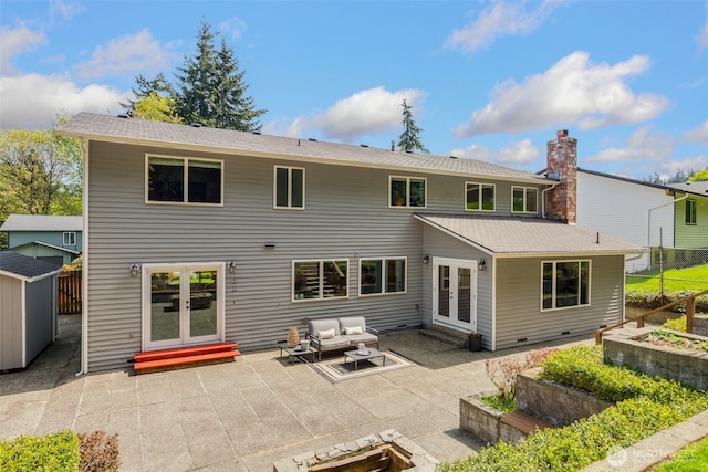 rear view of house with an outdoor hangout area, a storage shed, entry steps, french doors, and a patio