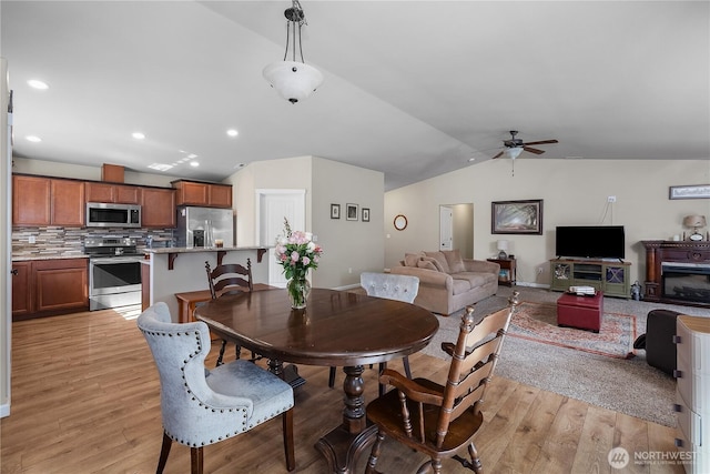 9321 179th Ln SW, Rochester, WA 98579 - dining space featuring vaulted ceiling, ceiling fan, light wood-type flooring, recessed lighting, and baseboards