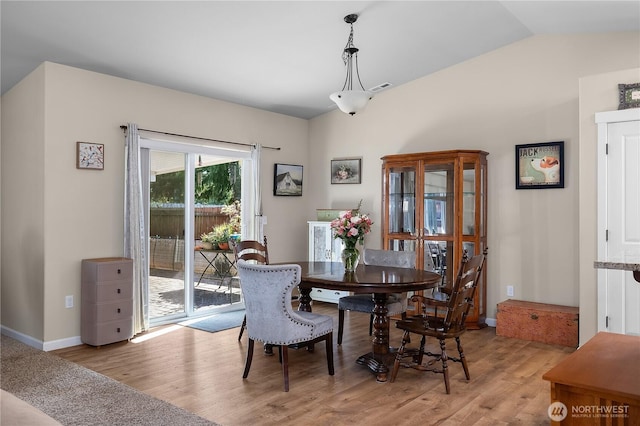 9321 179th Ln SW, Rochester, WA 98579 - dining area featuring light wood-style floors, vaulted ceiling, and baseboards
