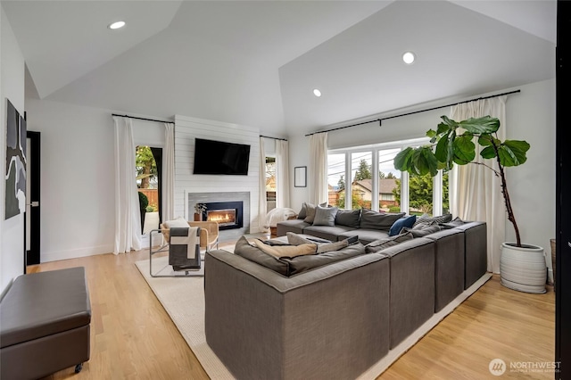 909 11th St, Mukilteo, WA 98275 - living area featuring light wood-type flooring, recessed lighting, a large fireplace, and plenty of natural light