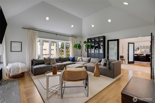 909 11th St, Mukilteo, WA 98275 - living area featuring high vaulted ceiling, wood finished floors, and recessed lighting
