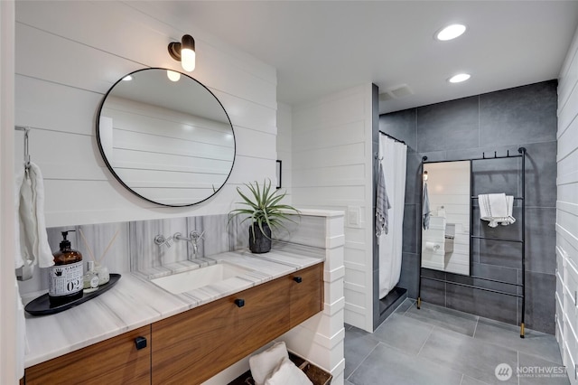 909 11th St, Mukilteo, WA 98275 - full bathroom with recessed lighting, tiled shower, vanity, decorative backsplash, and tile patterned flooring