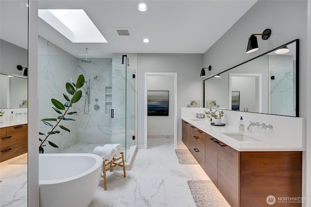 909 11th St, Mukilteo, WA 98275 - bathroom with a sink, a marble finish shower, double vanity, marble finish floor, and a skylight