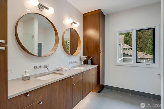 909 11th St, Mukilteo, WA 98275 - full bath with tile patterned floors, baseboards, double vanity, and a sink