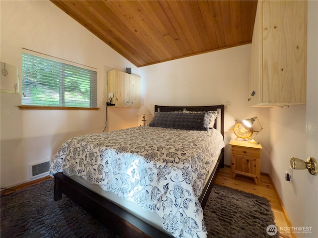 36 K Beach Way, Hat Island, WA 98206 - bedroom with lofted ceiling, wooden ceiling, wood finished floors, and baseboards