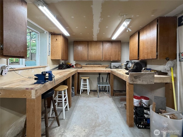 36 K Beach Way, Hat Island, WA 98206 - kitchen featuring brown cabinets, concrete floors, and wood counters