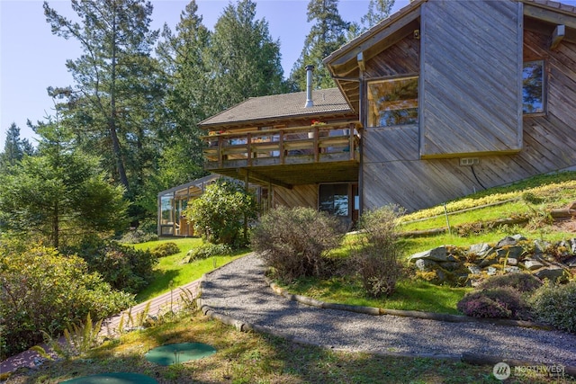 rear view of house with a deck