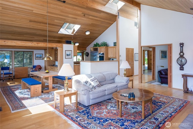living room with a skylight, high vaulted ceiling, wooden ceiling, and light wood-style flooring