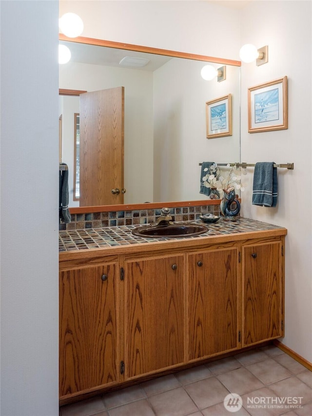 bathroom with vanity and tile patterned flooring