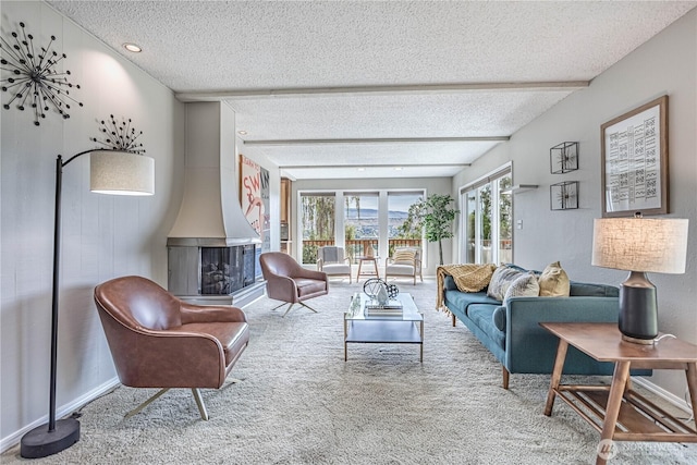 living room featuring a textured ceiling and carpet flooring