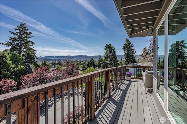 wooden terrace featuring a mountain view