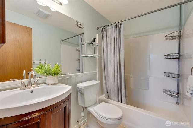 bathroom with toilet, visible vents, shower / bath combination with curtain, and vanity