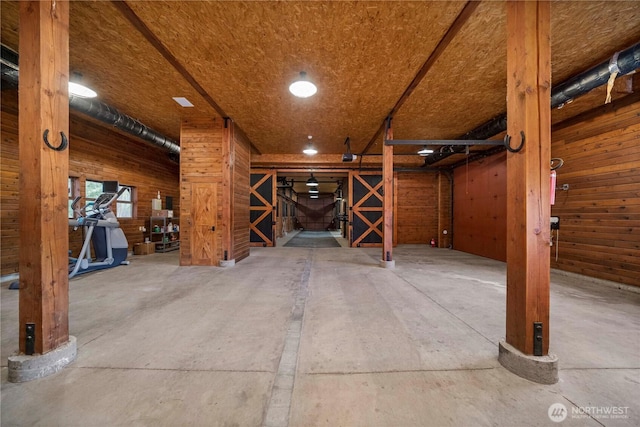 miscellaneous room with wooden walls