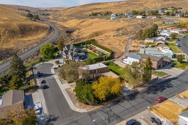 aerial view with a mountain view and a residential view