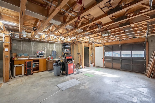garage featuring a workshop area and a garage door opener