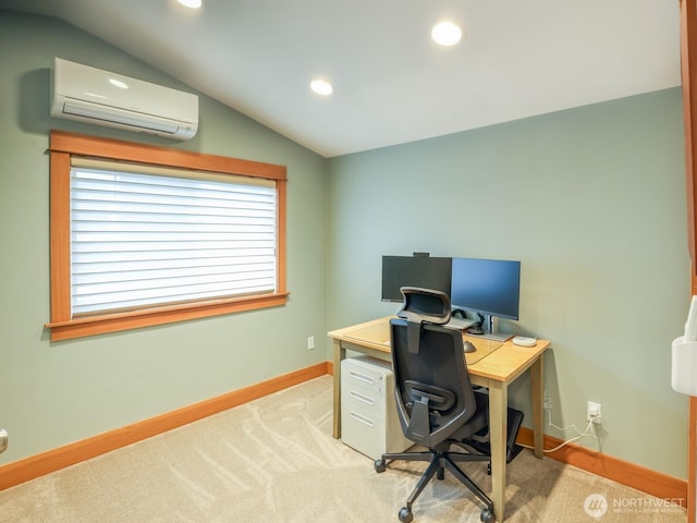 office area with vaulted ceiling, baseboards, an AC wall unit, and light colored carpet