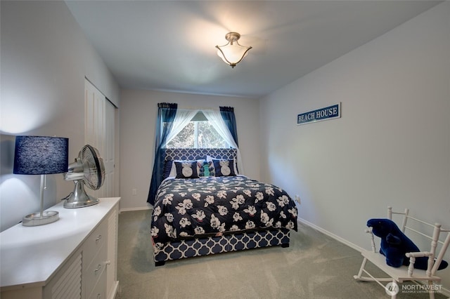bedroom featuring carpet flooring and baseboards