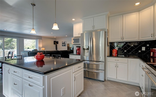 kitchen with recessed lighting, decorative backsplash, light tile patterned floors, appliances with stainless steel finishes, and dark countertops