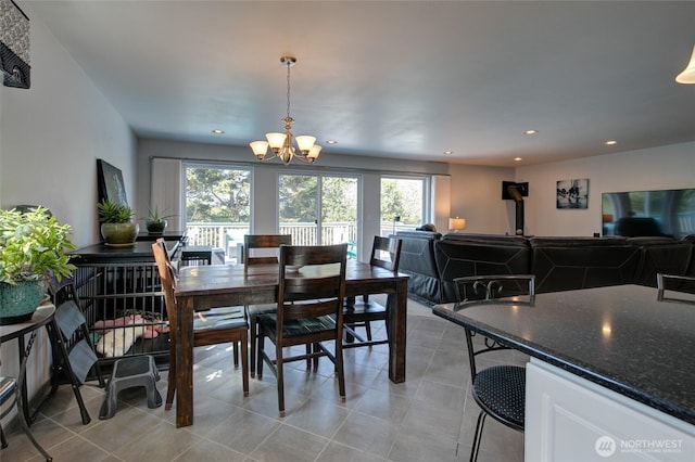 dining area with an inviting chandelier, light tile patterned flooring, and recessed lighting