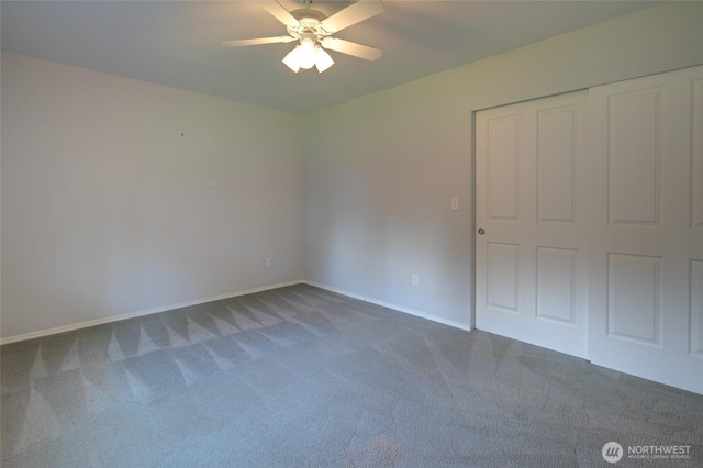 unfurnished bedroom featuring baseboards, ceiling fan, a closet, and carpet flooring