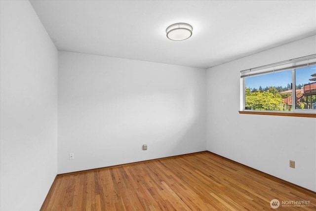 unfurnished room featuring light wood-type flooring