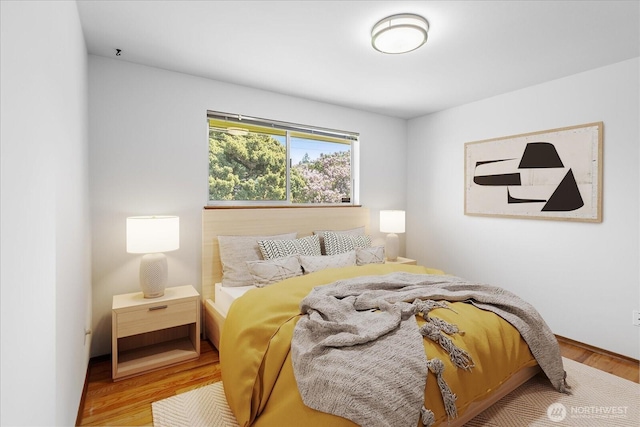 bedroom featuring wood finished floors