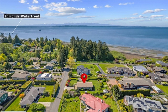 birds eye view of property featuring a residential view and a water view