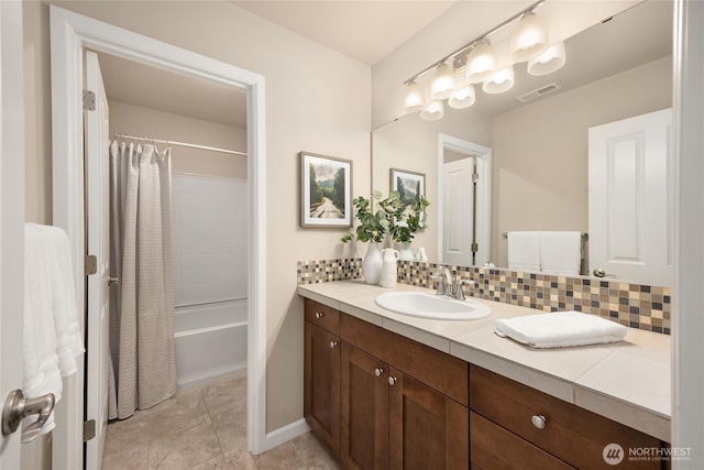 full bathroom featuring decorative backsplash, visible vents, tile patterned flooring, vanity, and shower / bath combo with shower curtain