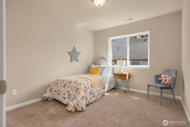 bedroom with carpet floors, baseboards, and visible vents