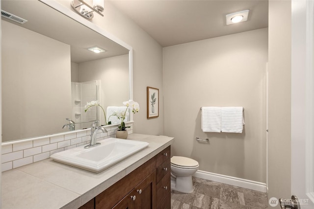 bathroom featuring vanity, visible vents, a shower, toilet, and stone finish floor