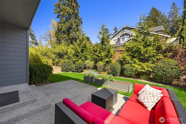 view of patio with fence and an outdoor living space