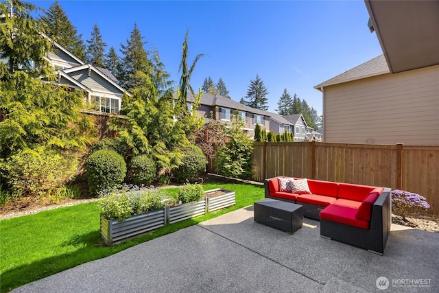 view of patio / terrace featuring outdoor lounge area, a residential view, and a fenced backyard