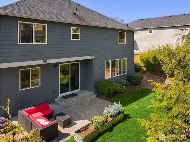 back of property featuring an outdoor hangout area, a lawn, a patio area, and roof with shingles