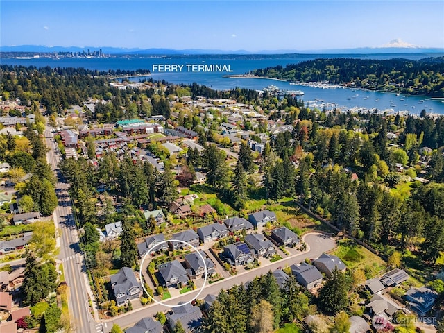 birds eye view of property featuring a residential view and a water view