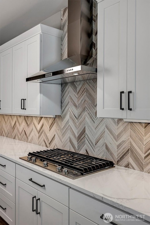1343 211th Ave NE, Sammamish, WA 98074 - kitchen featuring wall chimney exhaust hood, stainless steel gas stovetop, backsplash, white cabinets, and light stone counters