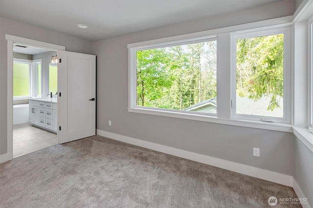 1343 211th Ave NE, Sammamish, WA 98074 - unfurnished bedroom featuring light carpet and ensuite bathroom