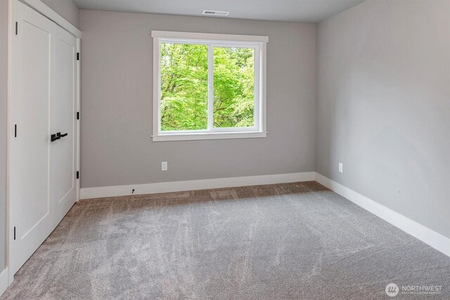 1343 211th Ave NE, Sammamish, WA 98074 - carpeted empty room featuring baseboards