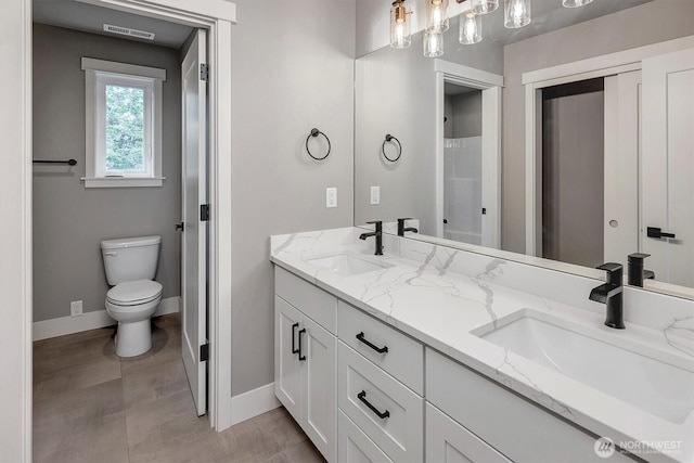 1343 211th Ave NE, Sammamish, WA 98074 - full bathroom featuring double vanity and baseboards