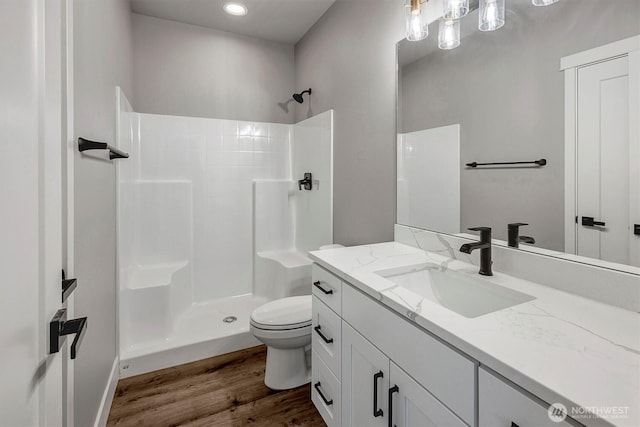1343 211th Ave NE, Sammamish, WA 98074 - full bathroom with a shower, vanity, wood finished floors, and recessed lighting