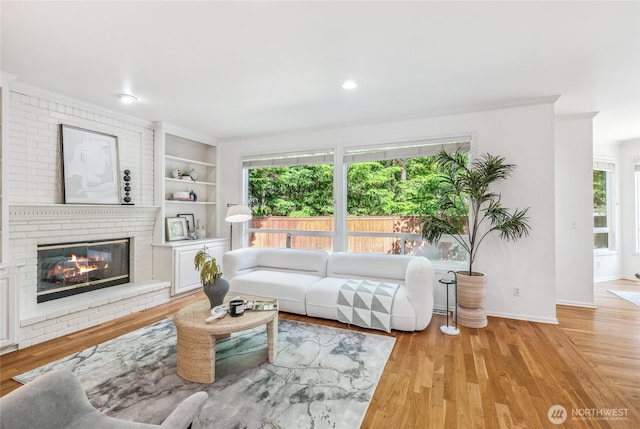 16639 Northup Way, Bellevue, WA 98008 - living area featuring a brick fireplace, wood finished floors, and recessed lighting