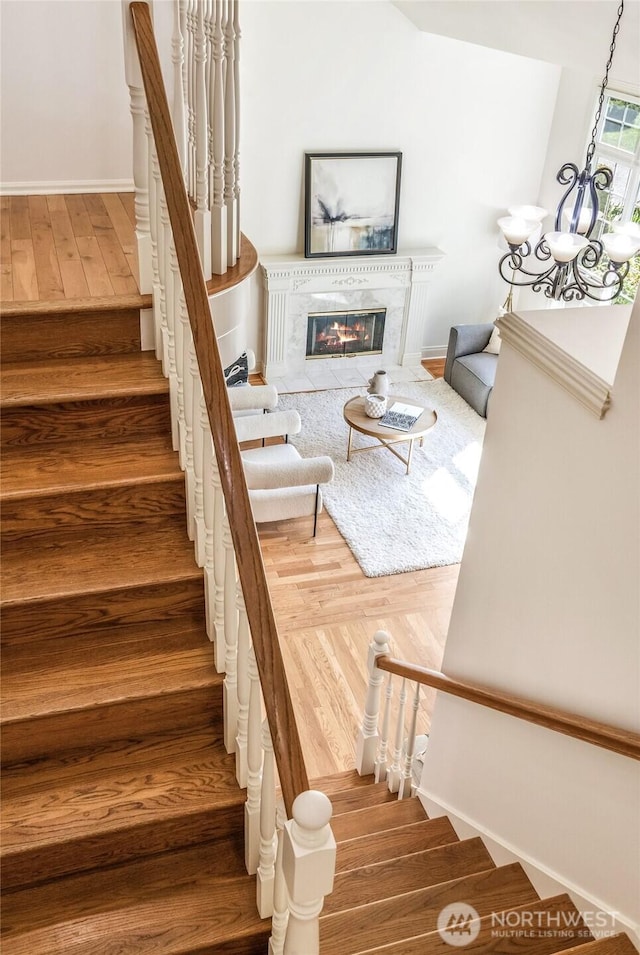 16639 Northup Way, Bellevue, WA 98008 - stairs with wood finished floors and a fireplace